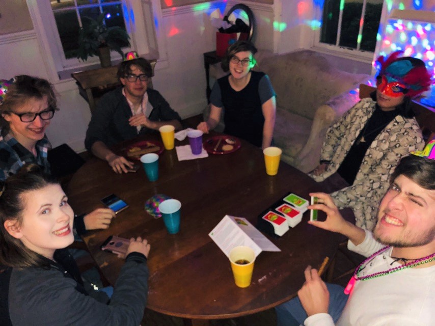 GSO students play German Apples to Apples at an event.
